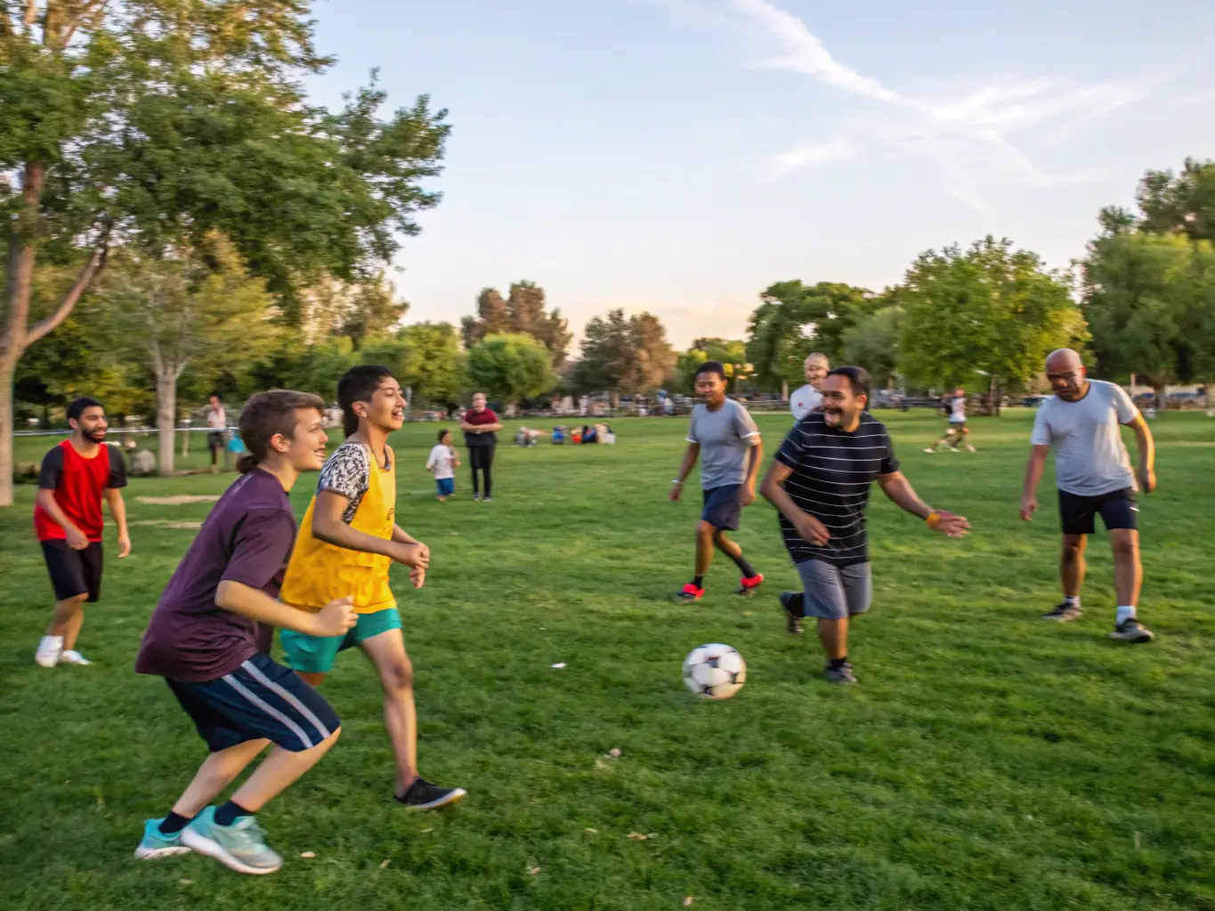 A dynamic image of community members participating in a sports activity at CASTEL CLOS, such as a team sport or fitness class. The scene is energetic and inclusive, with participants of all ages and abilities.